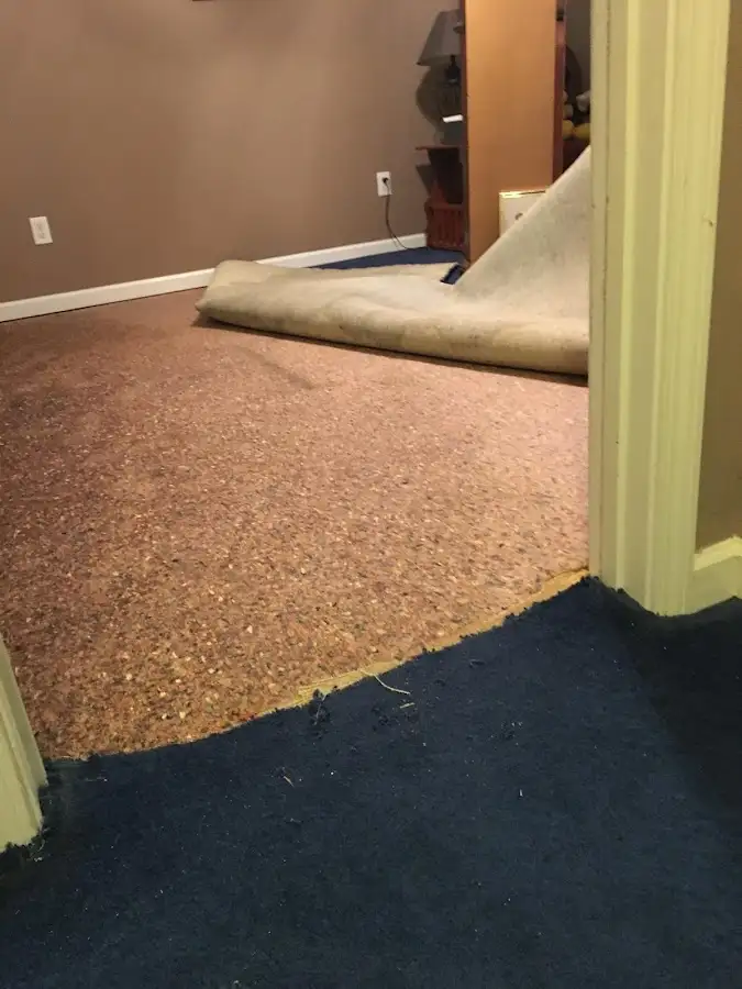 Carpet pad removal revealing water damage during Drying & Dehumidification in Anadarko